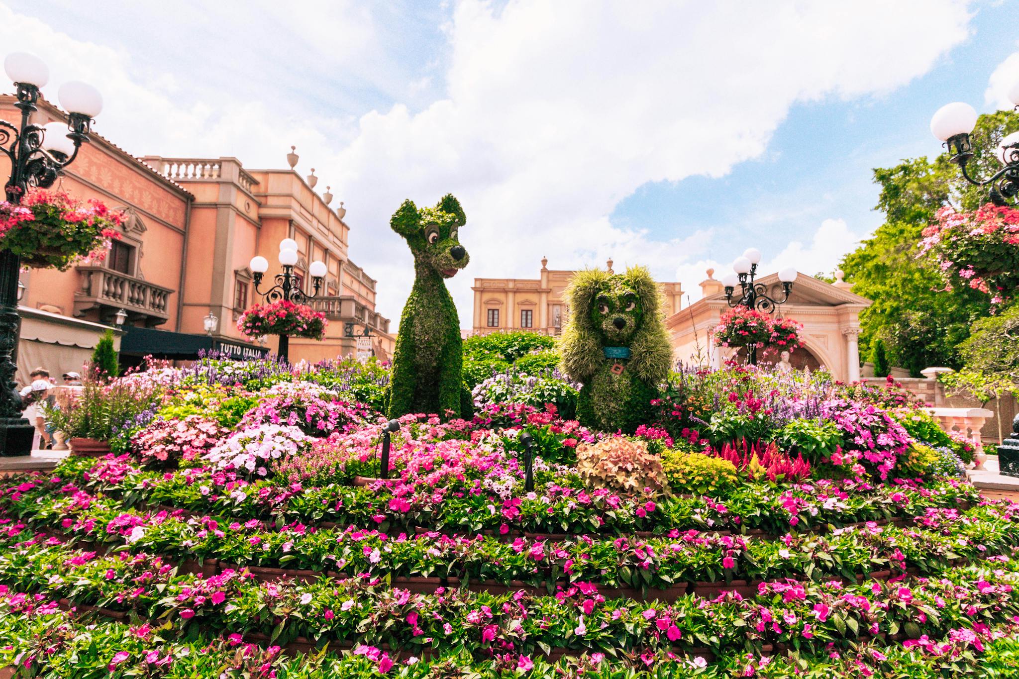 Vibrant floral display featuring iconic character topiary at Epcot, Bay Lake, Florida.